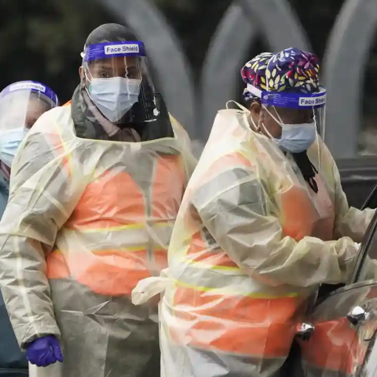 Workers administer a Covid-19 vaccine at a Los Angeles county site at California State University Northridge on Tuesday. Photograph: Marcio José Sánchez/AP