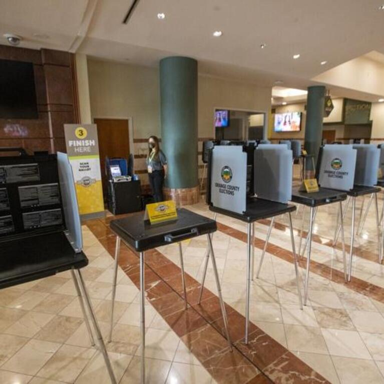 In this photo from September 16, 2020, an Orange County Registrar of Voters election services worker stands by as the media gets a view of the "Super Vote Center Site" for walk-in and drive-thru voting starting Oct. 30th at the Honda Center in Anaheim. The OC Registrar of Voters held a media showcase and announced a new partnership with the Honda Center and the Anaheim Ducks organization to expand access to voting in the upcoming November 3, 2020, Presidential General Election. For the first time in history
