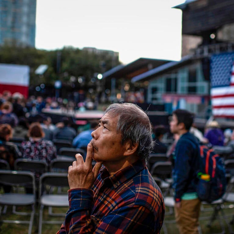 A supporter waits for presidential candidate Elizabeth Warren at a town hall in Houston on Feb. 29, 2020