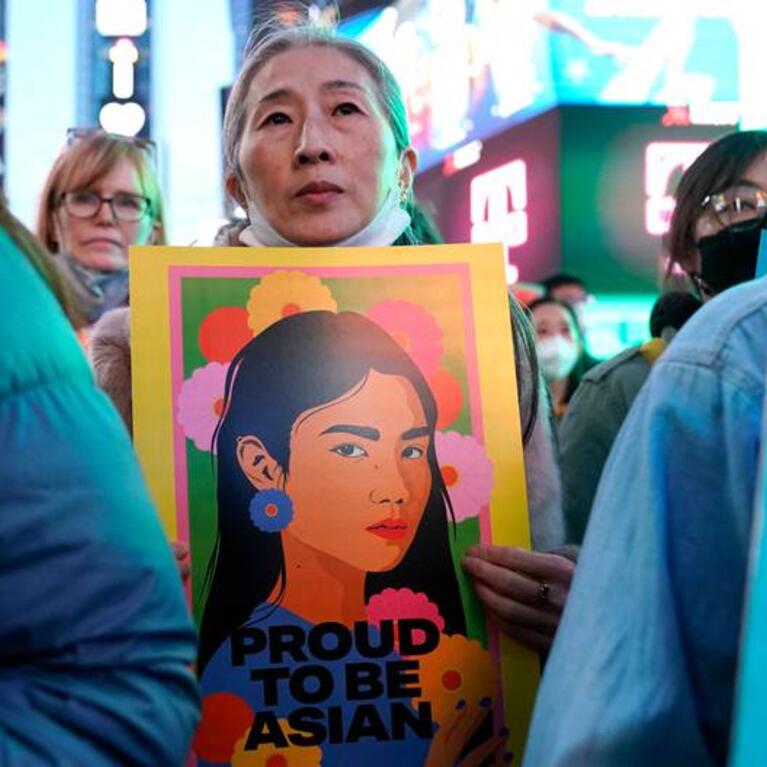 People rally calling for action and awareness on rising incidents of hate crime against Asian-Americans in Times Square.
