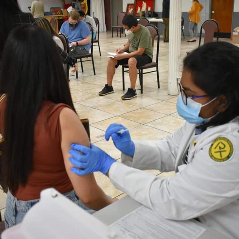 A mobile clinic sponsored by Eastern Michigan University provides free vaccines at the Philippine American Community Center of Michigan (PACCM) in Southfield. 