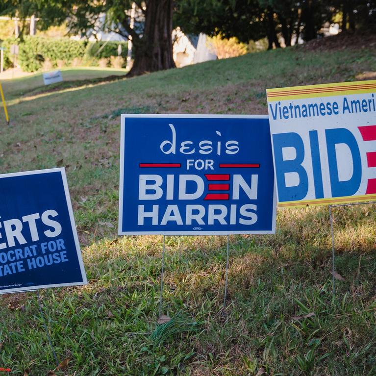 Political signs outside the home of Cam Ashling, a Democratic activist in Georgia.
