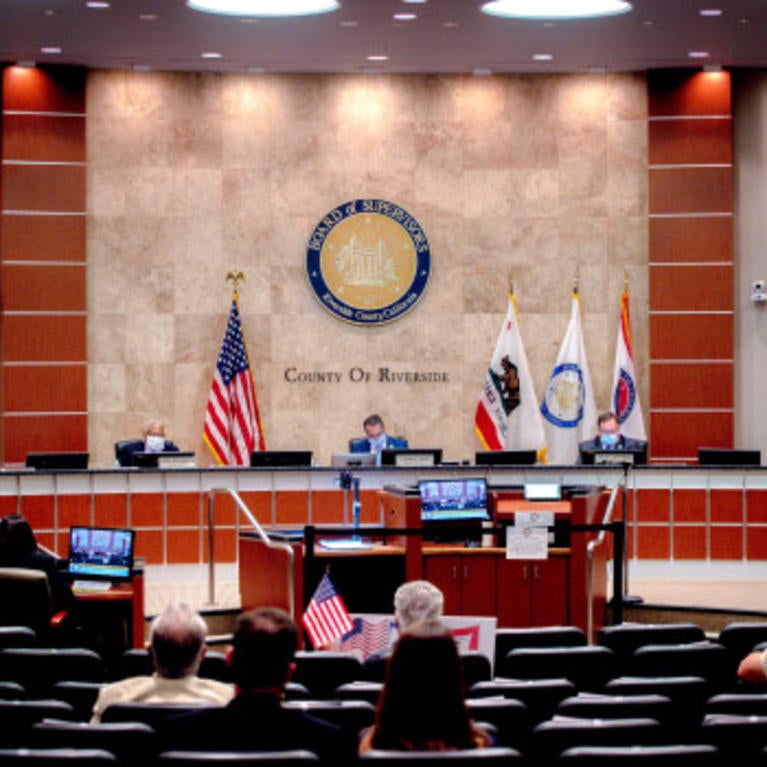Supervisors, wearing protective face masks as a precaution against the spread of the new coronavirus, listen to public comment via telephone during the Riverside County Board of Supervisors meeting to decide whether to lift coronavirus health orders in Riverside on Tuesday, May 5, 2020. (Photo by Watchara Phomicinda, The Press-Enterprise/SCNG)