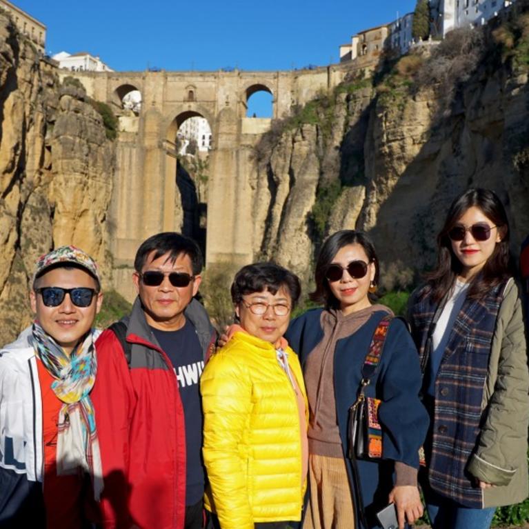 Charlie Gu, far left, and his husband, Thomas Alfieri, far right, with Gu’s family on vacation in Spain. Gu, who lives in San Francisco, uses WeChat for his business and to keep in touch with his family abroad.(Charlie Gu)