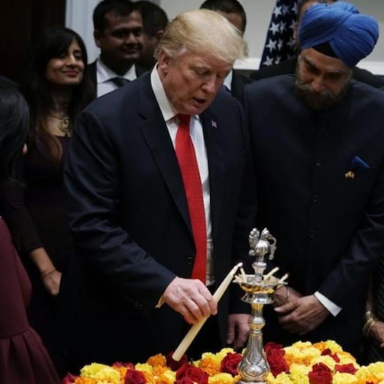 President Trump celebrates Diwali with former Indian ambassador to the US Arun Singh, along with others from the Indian community, at the White House in 2018. (File photo)