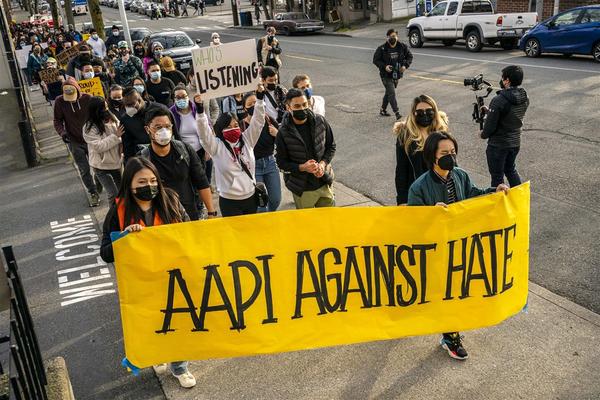 Demonstrators march through the Chinatown-International District during a "We Are Not Silent" rally and march against anti-Asian hate and bias on March 13, 2021 in Seattle.David Ryder / Getty Images