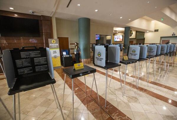 In this photo from September 16, 2020, an Orange County Registrar of Voters election services worker stands by as the media gets a view of the "Super Vote Center Site" for walk-in and drive-thru voting starting Oct. 30th at the Honda Center in Anaheim. The OC Registrar of Voters held a media showcase and announced a new partnership with the Honda Center and the Anaheim Ducks organization to expand access to voting in the upcoming November 3, 2020, Presidential General Election. For the first time in history