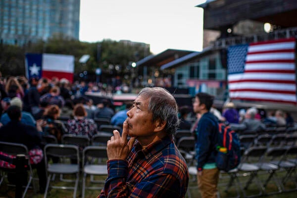 A supporter waits for presidential candidate Elizabeth Warren at a town hall in Houston on Feb. 29, 2020