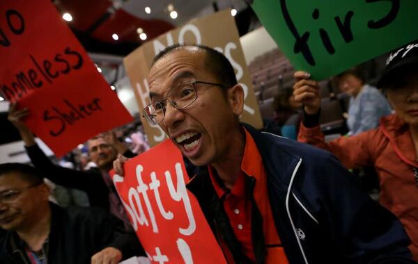 Participants in a town hall meeting in Hacienda Heights on May 4 voice their opposition to plans to convert a Motel 6 into permanent housing for homeless people. (Luis Sinco / Los Angeles Times)