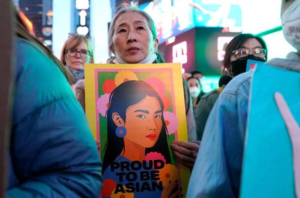 People rally calling for action and awareness on rising incidents of hate crime against Asian-Americans in Times Square.