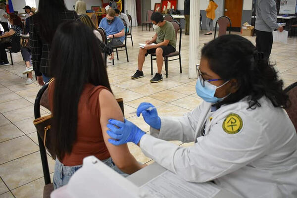 A mobile clinic sponsored by Eastern Michigan University provides free vaccines at the Philippine American Community Center of Michigan (PACCM) in Southfield. 