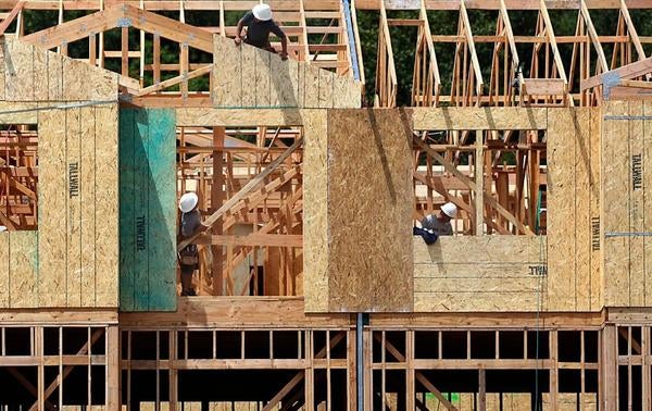 Picture of construction workers building housing 