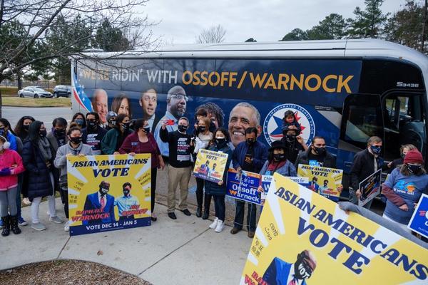 Supporters of Democratic senate candidates Rev. Raphael Warnock and Jon Ossoff gather at Shorty Howell Park in Duluth, Georgia on Dec. 20 for a "K-Pop Dance Rally" early voting event. The event was organized by the Georgia chapter of the Asian American Action Fund, a Democratic PAC Arvin Temkar