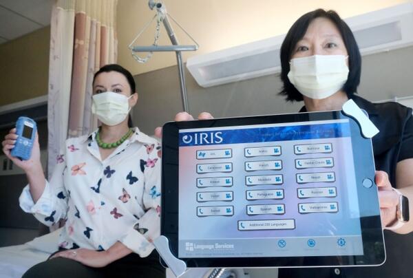 USC Arcadia Hospital staff, Leticia Brizuela-Rodriguez, Volunteer Services and Mimi His, Patient Relations Rep display translation devices used to bridge communication barriers with their patients on Thursday, September 22, 2022. 